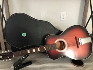 guitar and guitar case with 4-H sticker