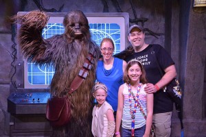 Tracy, wife Laura, and daughters Isabel and Violet at Disneyworld meeting Chewbaca from Star Wars.