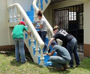 Painting the stairs of the church.