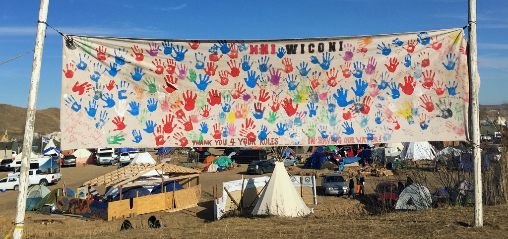 A banner at Oceti Sakowin camp says Mni Wiconi or Water is Life