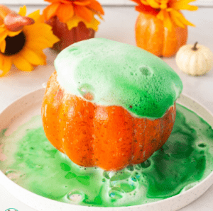 Picture of a Mini Pumpkin Volcano made with baking soda, food coloring, and vinegar