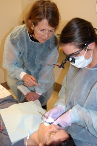Instructor teaching a student in clinic
