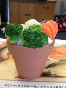 Use a potting container to hold dip add some veggies to the garden for a healthy snack.