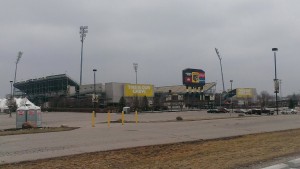 This photo showcases the MAPFRE Stadium, which houses the Columbus Crew, Columbus's very own professional club soccer team. This picture showcases what appears to be an empty stadium, and an almost empty parking lot; however, this is a very different image than one would see on a game day in late spring or the summer. The cold weather and absence of entertainment led to dreary appearance of the stadium, but the passion and love of sports in the city is still evident and represented in this photograph.