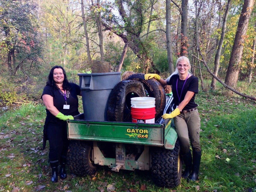 Ohio State Mansfield Education students Mellissa Johnson, left, and Paige Poffenbaugh show some of the debris that students at Eastern Elementary School in Lexington found in a Clearfork tributary. The duo created the service learning project for the students.