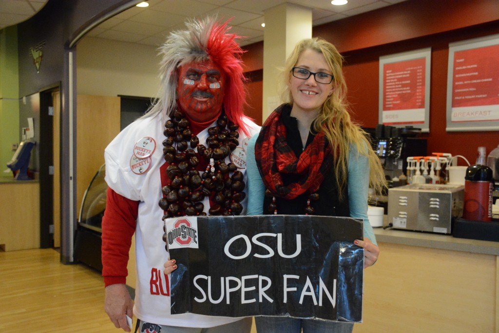 Buckeyeman Larry Lokai and granddaughter Catherine Williams visit the Cyber Café.