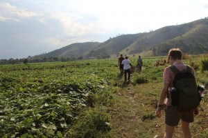 Me walking with a group through a field near Fauge, Haiti