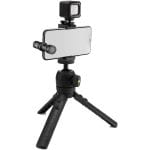 Vlogging kit with tripod, smartphone, light, and microphone