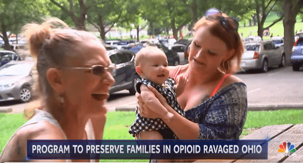 image of a family with text "Program to Preserve Families in Opioid Ravaged Ohio"
