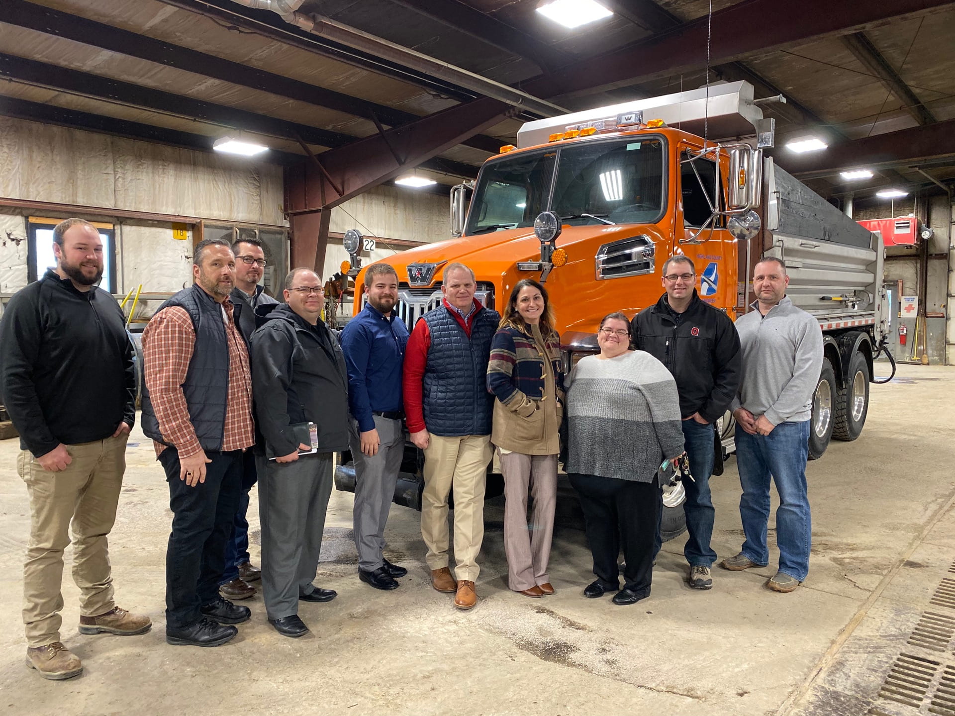 Left to right: Christian Dunlap, Bill Davis, Mel McKenzie, Jim Tomko, Jacob Alexander, Scott Lewis, Courtney Gallimore, Amanda Hall, Blaine Williams, and Highland County Engineer Chris Fauber in the shop at the Engineer’s Office. 