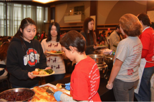 Volunteers serve students dinner at the Ohio Union's Thanksgiving
