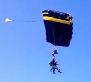 Black and gold parachute in the sky