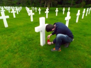 I placed an Ohio State University flag at one of the twelve Ohio State students. alumni, and staff graves at the Normandy American Cemetery and Memorial.